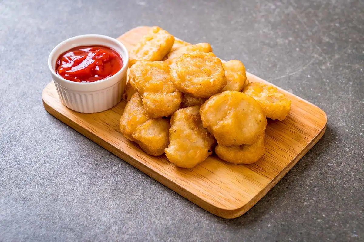 Chicken nuggets served with sauce